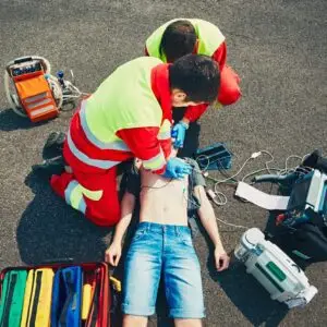 Rescue professionals doing CPR on a man