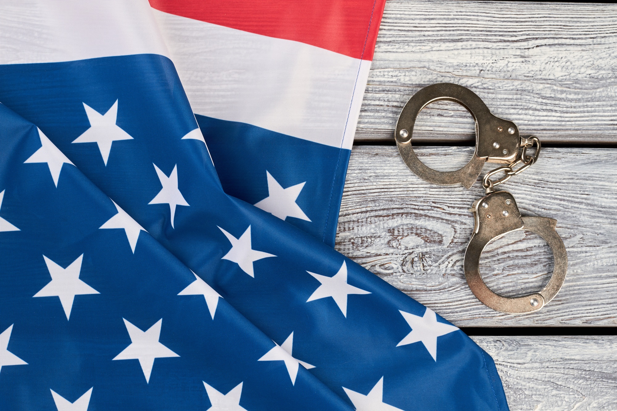 USA patriotic flag and handcuffs.